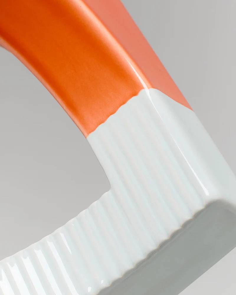 Tomar Buchstütze orange hellblau