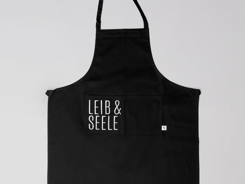 räder Schürze Leib & Seele schwarz 78x70cm